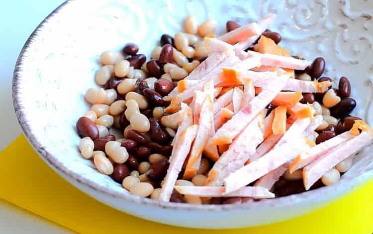 Mix the ingredients to make a salad.