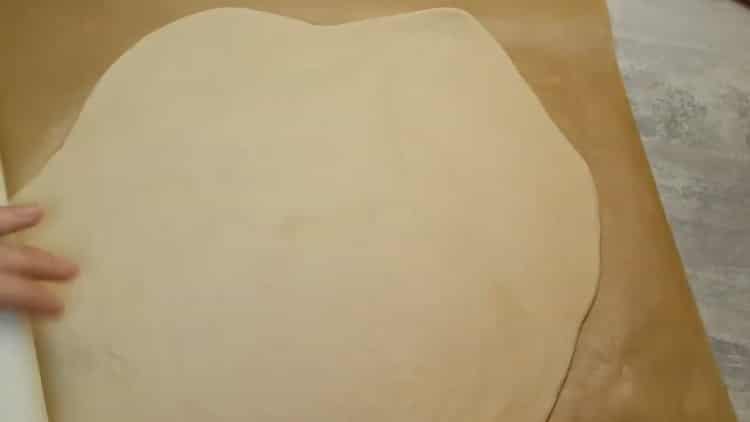 Roll out the dough to make pizza