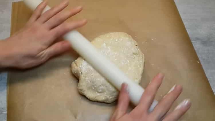 Roll out the dough to make pizza