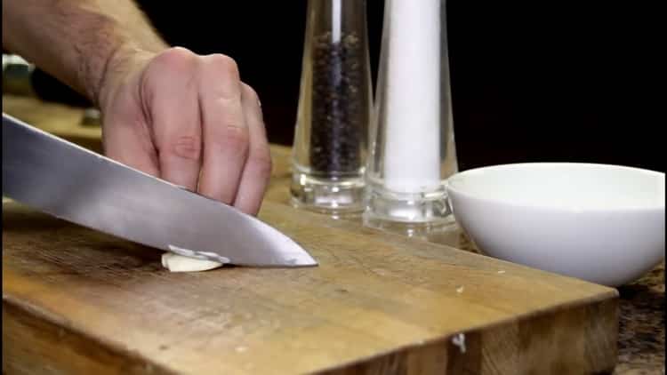 To cook meatballs, chop the garlic