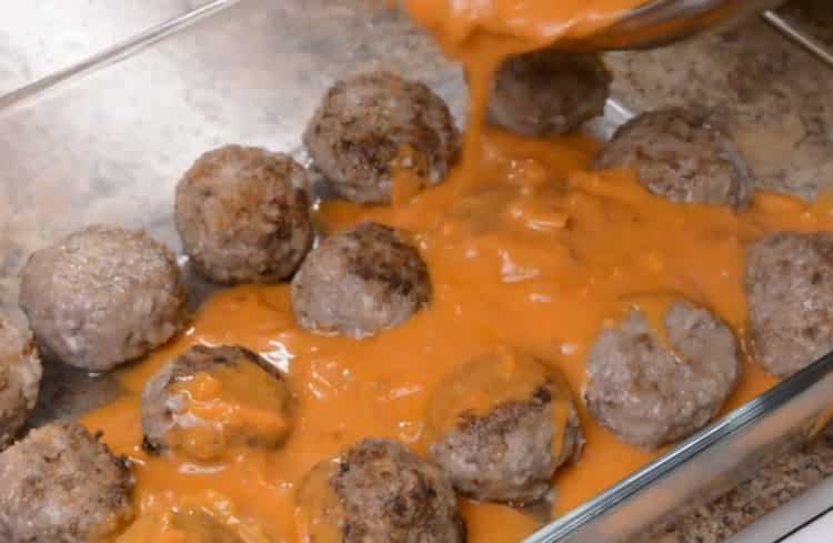 To cook meatballs, preheat the oven