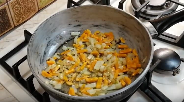 Add carrot to the onion.
