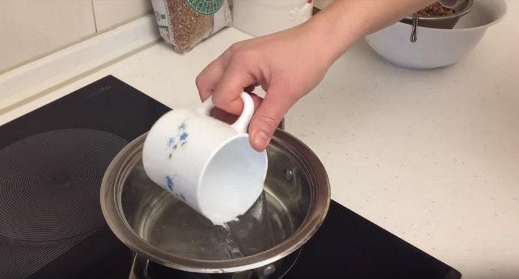 Pour water into a saucepan.