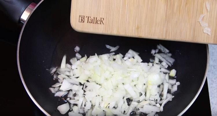 put the onion in a pan and fry.