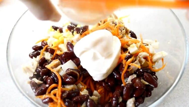 Dress salad with mayonnaise.