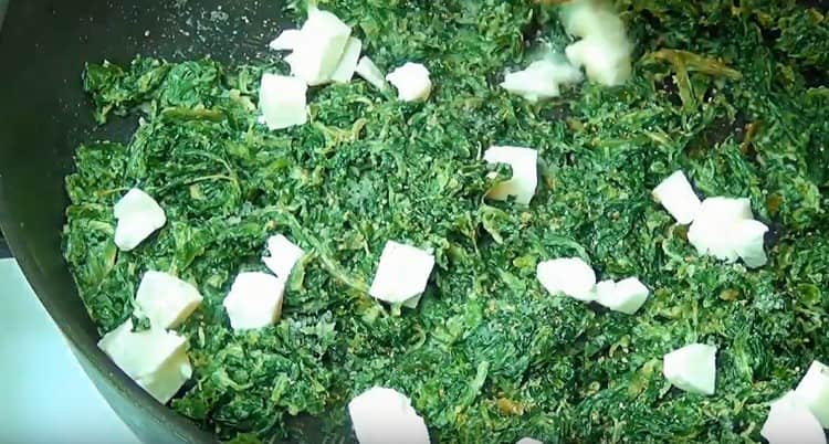 Add mozzarella and simmer the dish until the cheese melts.