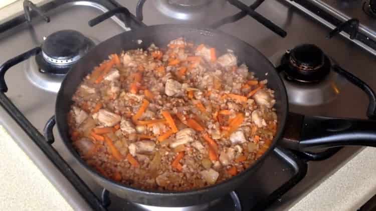 buckwheat with carrots and onions in a pan is ready