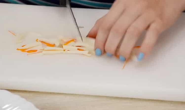 Cooking a salad with seaweed and crab sticks