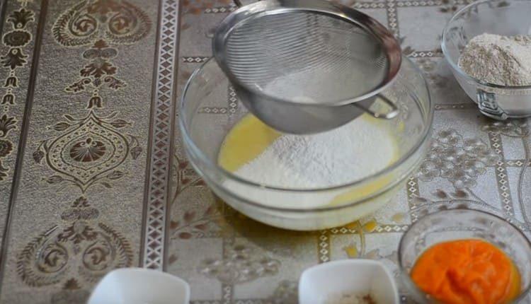 Sift flour into the mass.