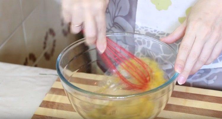 Beat eggs with salt and spices.