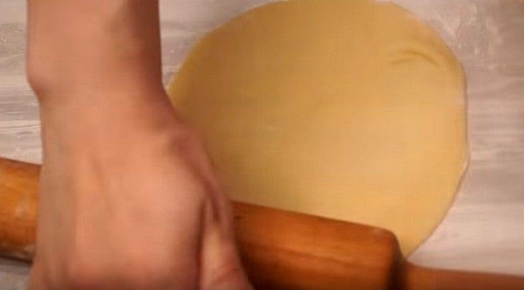 Each piece of dough is rolled into a cake.