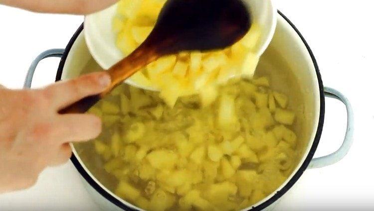 cut potatoes into slices and put in boiling water.