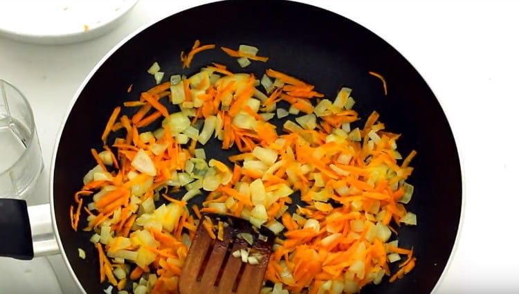 pass the chopped onions and carrots in a pan.