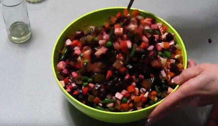 Season the vinaigrette with olive oil and mix.