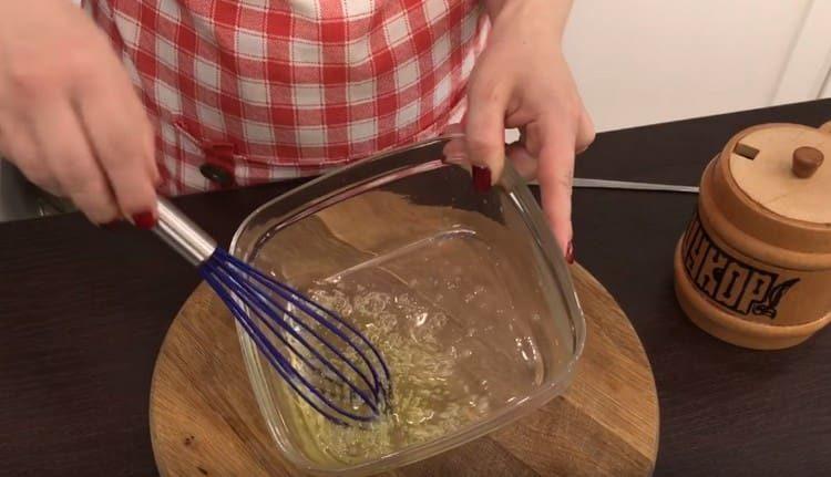 With a whisk, beat egg white slightly.