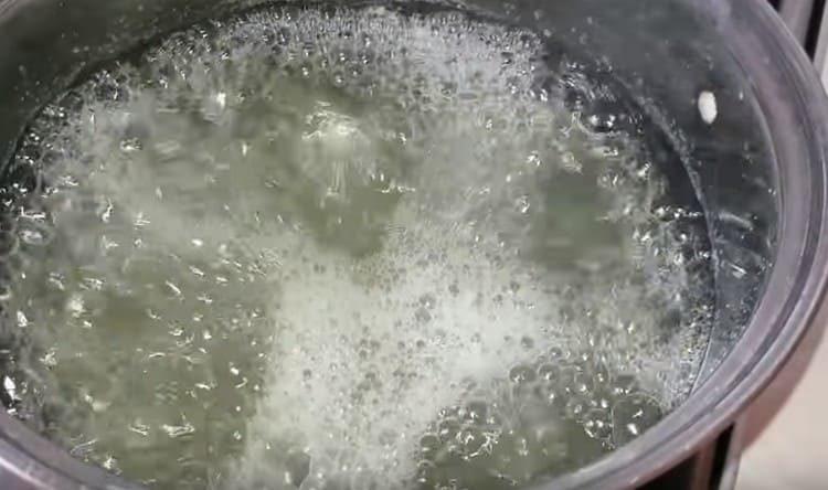 Drain the water from the cans and bring it to a boil.