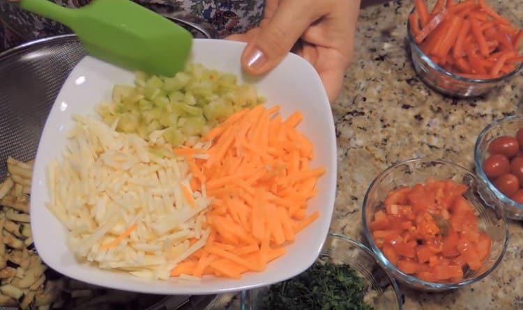 We cut carrots, parsnip root with thin strips, cut celery and hot pepper.