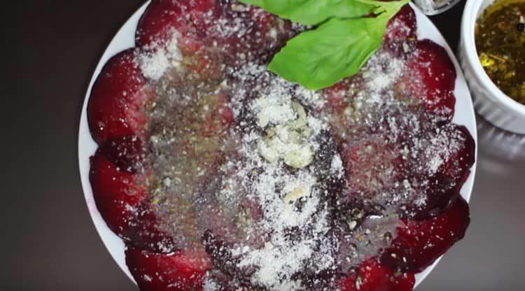 Sprinkle beetroot carpaccio with parmesan.