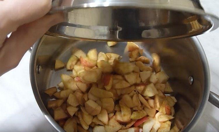 Cut the apples into slices and put in a saucepan.