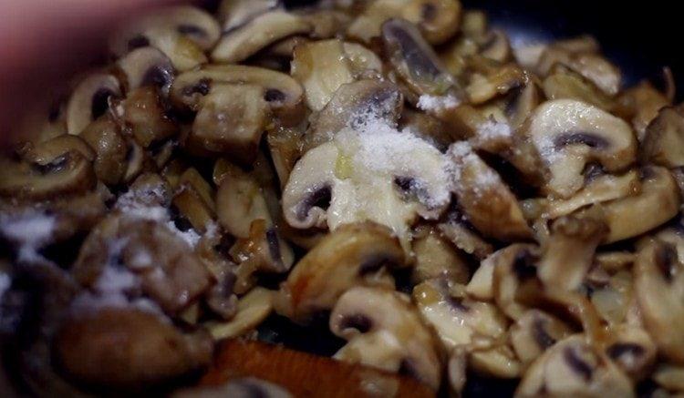 Add mushrooms, salt, pepper to the onion.
