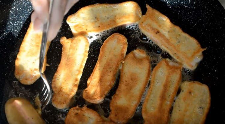 Fry the sticks on both sides.