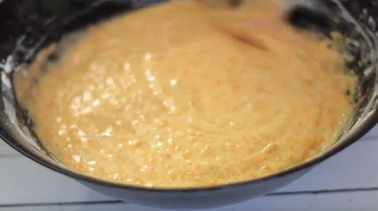 Add flour, baking powder, cinnamon and mix the dough.