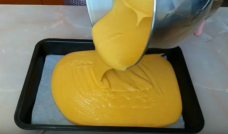 Pour the dough onto a baking sheet covered with parchment.