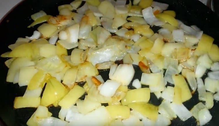 In a pan, fry chopped onions until golden.