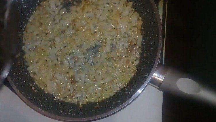 Fry the onion until golden brown.