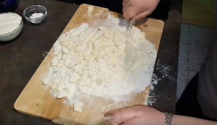 We chop butter with flour with a knife.