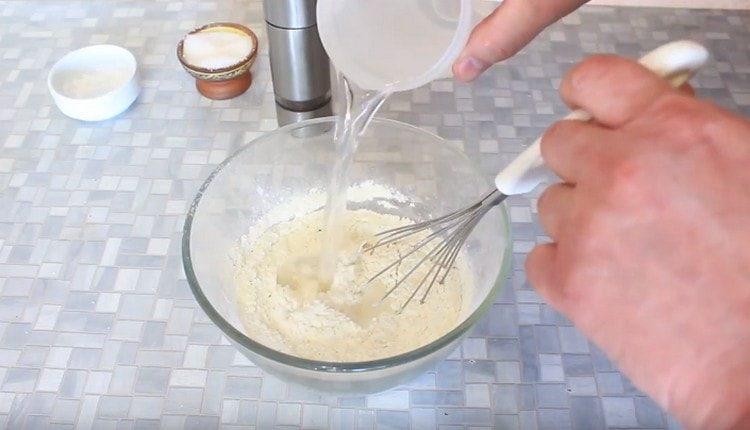 Add ice water to the dry components.