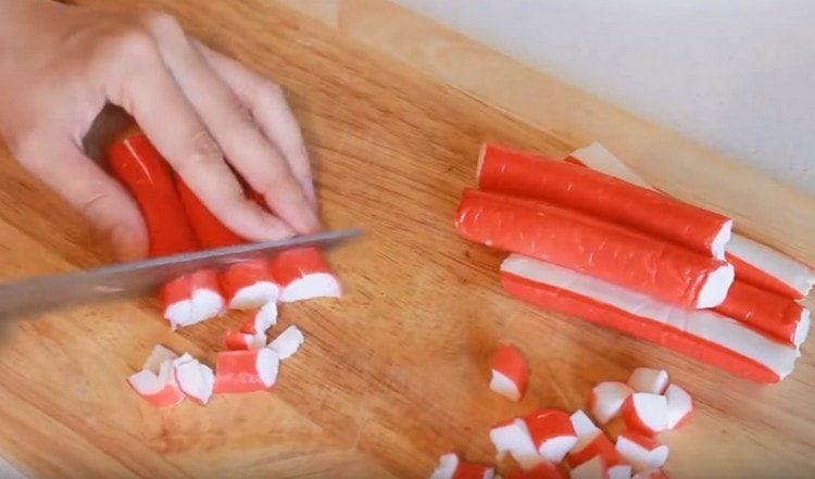 Cut the crab sticks.