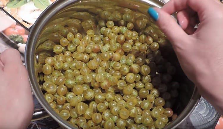 Rinse gooseberries and put in a pan.