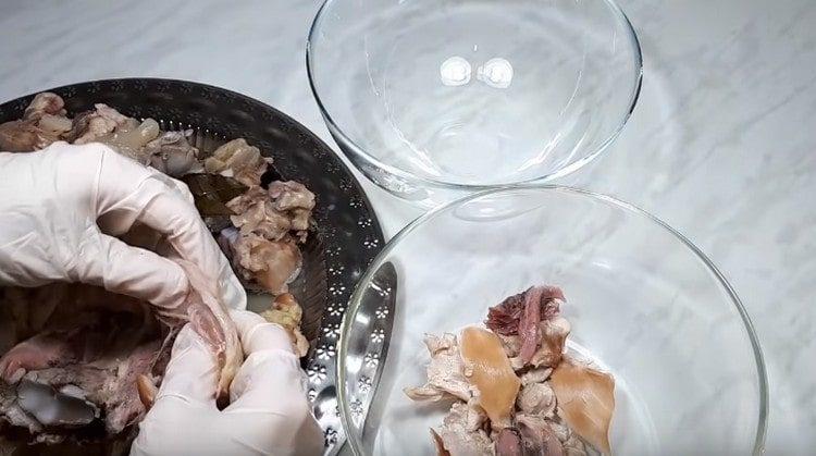 The meat is separated from the bones and divided into fibers.