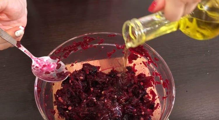 Season the salad with olive oil.