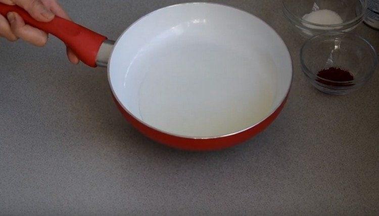 In a pan, heat the vegetable oil.