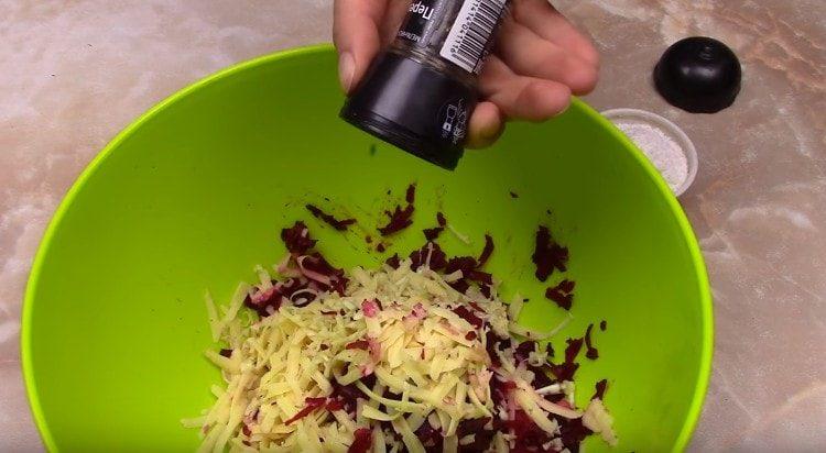 Add salt and pepper to the salad.