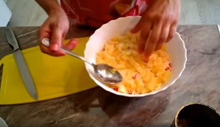 Spread a layer of canned pineapple, cut into pieces.