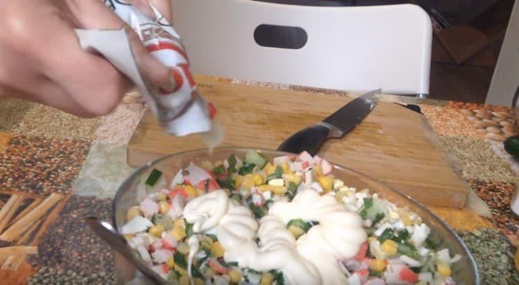 Add rice and season the dish with mayonnaise.