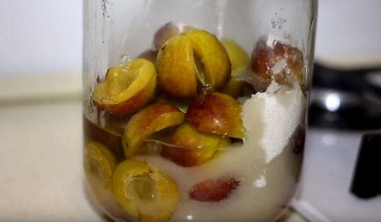 Pour fruit with sugar and boiling water.