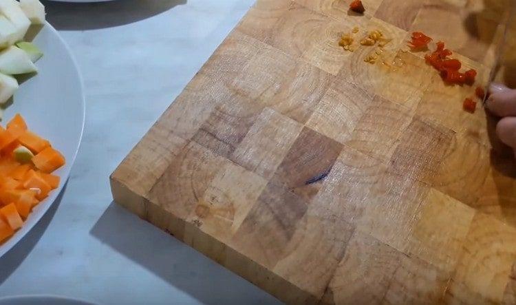 Grind hot pepper by removing seeds.