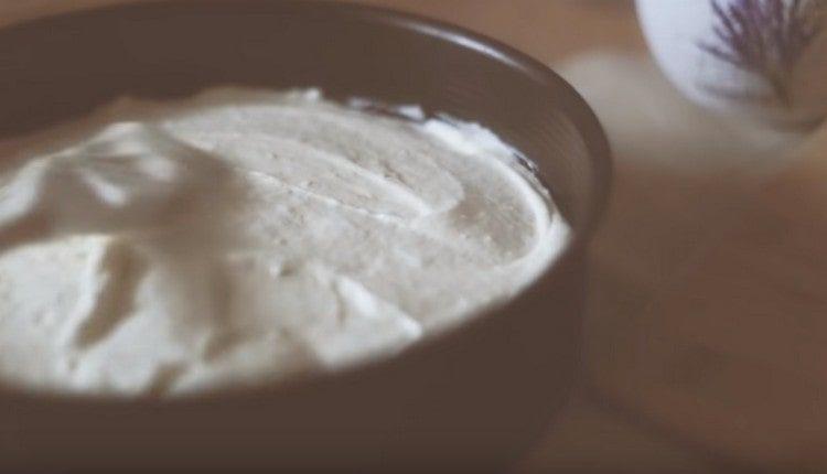 We shift the curd into a greased form.