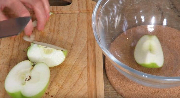 Cut apples into quarters.