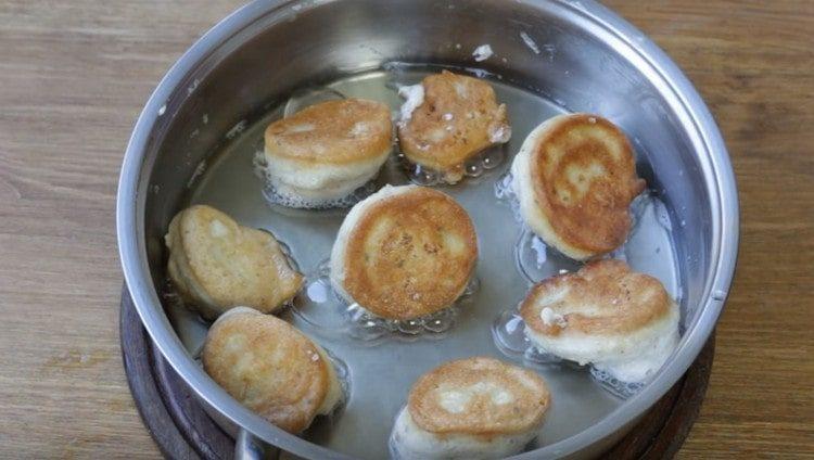 Cauliflower is fried in a batter in a pan very quickly.