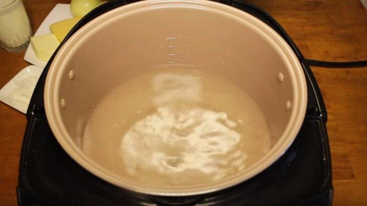 Pour water into the slow cooker, add salt