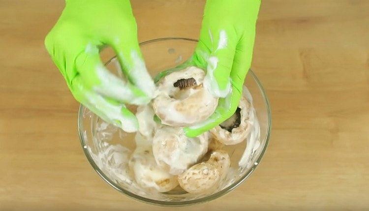 We wipe each mushroom hat with a marinade.