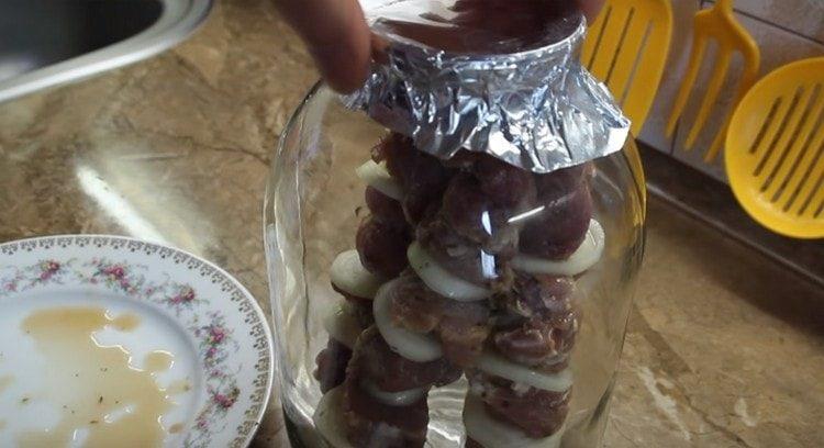 Tightly cover the neck of the can with foil.