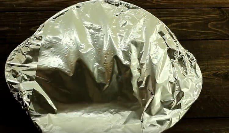 Cover the form with foil and put in the oven.