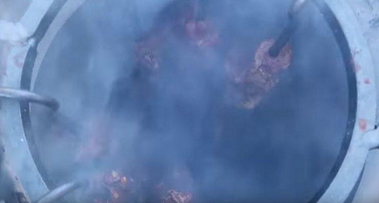 Set skewers with meat in the tandoor.