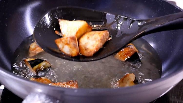 Fry the eggplant to cook.